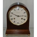Mahogany cased Comitti of London mantle clock with mechanical escapement movement, fully working