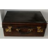 Early 20th century Leather travel case with green interior, marked Harrods London