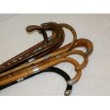 10 good quality antique walking sticks with silver bands or silver tops