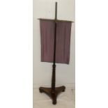 Victorian mahogany pole fire screen with later tapestry
