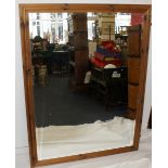 Very large pine wall mirror with bevelled edge glass