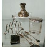 Selection of Various sterling silver items including Toast rack, cutlery, candle stick