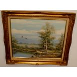 Oil on canvas painting of ducks flying over lake, signed Laszlo Ritter