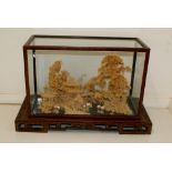 Early 20th century carved oriental cork scene in case