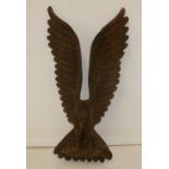 Large carved wooden eagle catching a fish. Both with glass eyes