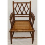 Victorian light wood carved bobble chair with whicker seat