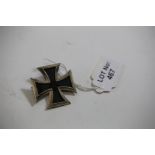 A GERMAN WWII STYLE IRON CROSS, dated 1939 with pinback fitting.