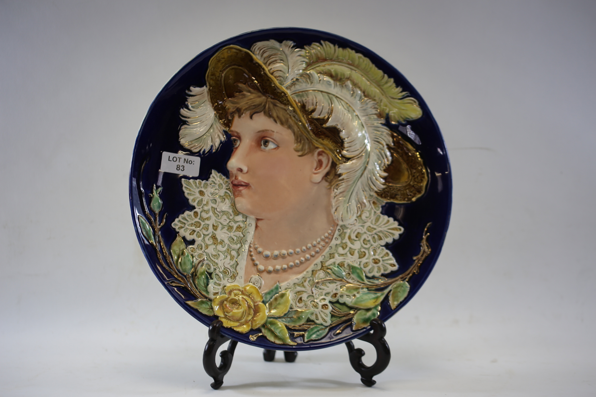 A LATE 19TH CENTURY ART NOUVEAU INFLUENCE CONTINENTAL POTTERY WALL PLAQUE decorated with a female