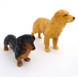 A Sylvac golden retriever. Stamped to base. 5 1/4'' high. Together with a Sylvac black and tan