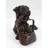 Contemporary Black Forest : An inkwell formed as a dachshund dog with glass eyes holding a bag