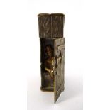 A c.1900 novelty vesta in the form of a wooden privy , the door hinging to reveal a man sat