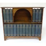 Charles Dickens Library  :  A Centennial oak bookcase containing 18 volumes with 1200