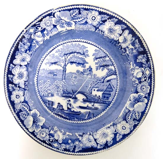 An early 19thC blue and white transfer printed plate decorated in Nuneham Courtenay pattern.