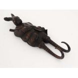 Black Forest : An early 20thC wall mounted twin coat hook formed as a shooting hair with glass