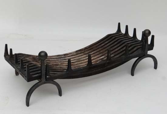 A Contemporary Blacksmith made wrought iron fire basket and fire dogs, the basket 36" wide x 16"