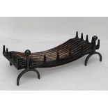 A Contemporary Blacksmith made wrought iron fire basket and fire dogs, the basket 36" wide x 16"