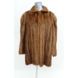 A Light brown ladies fox fur coat/jacket, with gold Chinese style patterned lining. CONDITION: