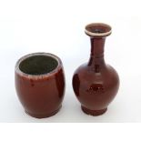 A large Chinese Sang de Beouf glazed vase together with a large Chinese Sang de Beouf glazed pot.