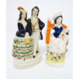 Victorian Staffordshire figures comprising a figure of a shepherdess with lamb, together with a male