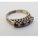 A white gold ring set with rubies and diamonds in a linear setting  CONDITION: Please Note -  we