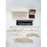 A quantity of assorted costume jewellery to include assorted pearl necklaces and a wristwatch