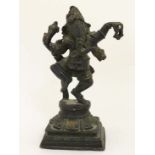 A bronze figure of dancing Ganesh, Nepal , 19th century, Depicted with four arms and balancing on