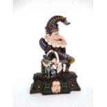 A Fisher Foundries Polychrome painted cast iron doorstop formed as Mr Punch  13" high  CONDITION: