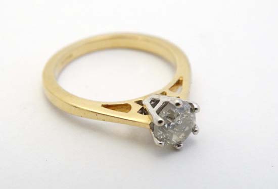 A 18ct gold ring set with diamond solitaire CONDITION: Please Note -  we do not make reference to