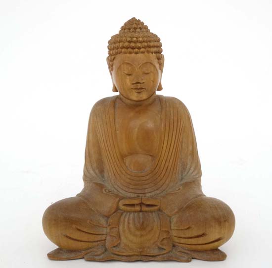 A mid - late 20thC carved wooden depiction of a seated Buddha 8 1/4" high  CONDITION: Please Note -