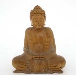 A mid - late 20thC carved wooden depiction of a seated Buddha 8 1/4" high  CONDITION: Please Note -