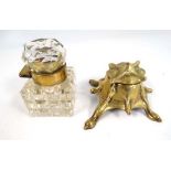 A c.1900 brass collared hobnail cut glass inkwell together with an Art Nouveau glass and brass