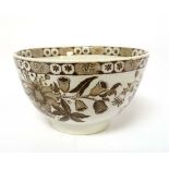 A small English 18th/19thC brown transfer-printed creamware bowl with floral decorative patterns.