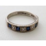 An 18ct gold ring set with 5 sapphires and 4 diamonds  CONDITION: Please Note -  we do not make