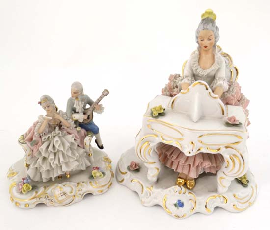 Dresden figurines depicting figures with glazed netting detail comprising a female seated at a