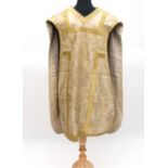 An early 20thC Roman Catholic Church ecclesiastical chasuble, probably used for Easter: Cream and