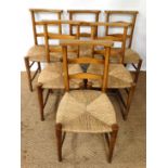 Six 19thC chapel chairs with envelope rush seats and ladder backs with shaped top rail .( A