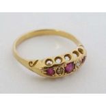 A gold ring set with rubies and diamonds  CONDITION: Please Note -  we do not make reference to