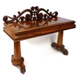 A Victorian mahogany hall / side table with 2 turned tapering columns to either end, central