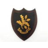 Armorial : A shield depicting Acorns and oak leaves with motto under ' In Pectore Robur ' ( Heart of