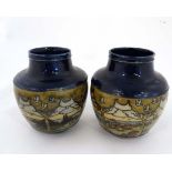 An Art Deco pair of Doulton stoneware shaped vases painted with scene of the genre with stylised