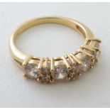 An 18ct gold ring set with 10 white stones  CONDITION: Please Note -  we do not make reference to