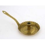 A 19thC brass chamber stick with pierced quatrefoil trefoil like decoration with petal edge 6 1/2"