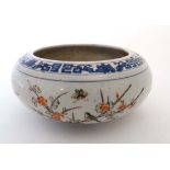 A Chinese Famille-Vert bowl. Decorated with blue geometric and foliate design to rim. The sides