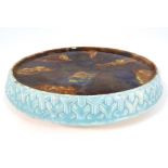 A 19thC Majolica Scottish pottery cheese board of circular form. With blue and white decoration to