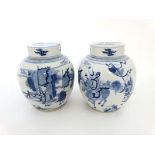 A pair of Chinese blue and white ginger jars with lids,  in Kang Xi style, possibly 19thC , 8 1/