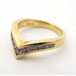 An 18ct gold ring set with 13 channel set diamonds CONDITION: Please Note -  we do not make