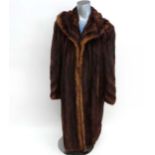 A Ladies vintage chestnut colour male mink? coat, with dark brown lining, monogram inside reads