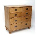 A late 19thC stripped pine chest of drawers comrprising 2 short over 3 graduated long drawer