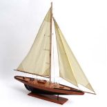 Static Model yacht. Wooden hull , sectional wooden deck possibly cedar with white cotton sails and