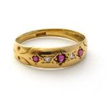 An 18ct gold ring set with 3 rubies and